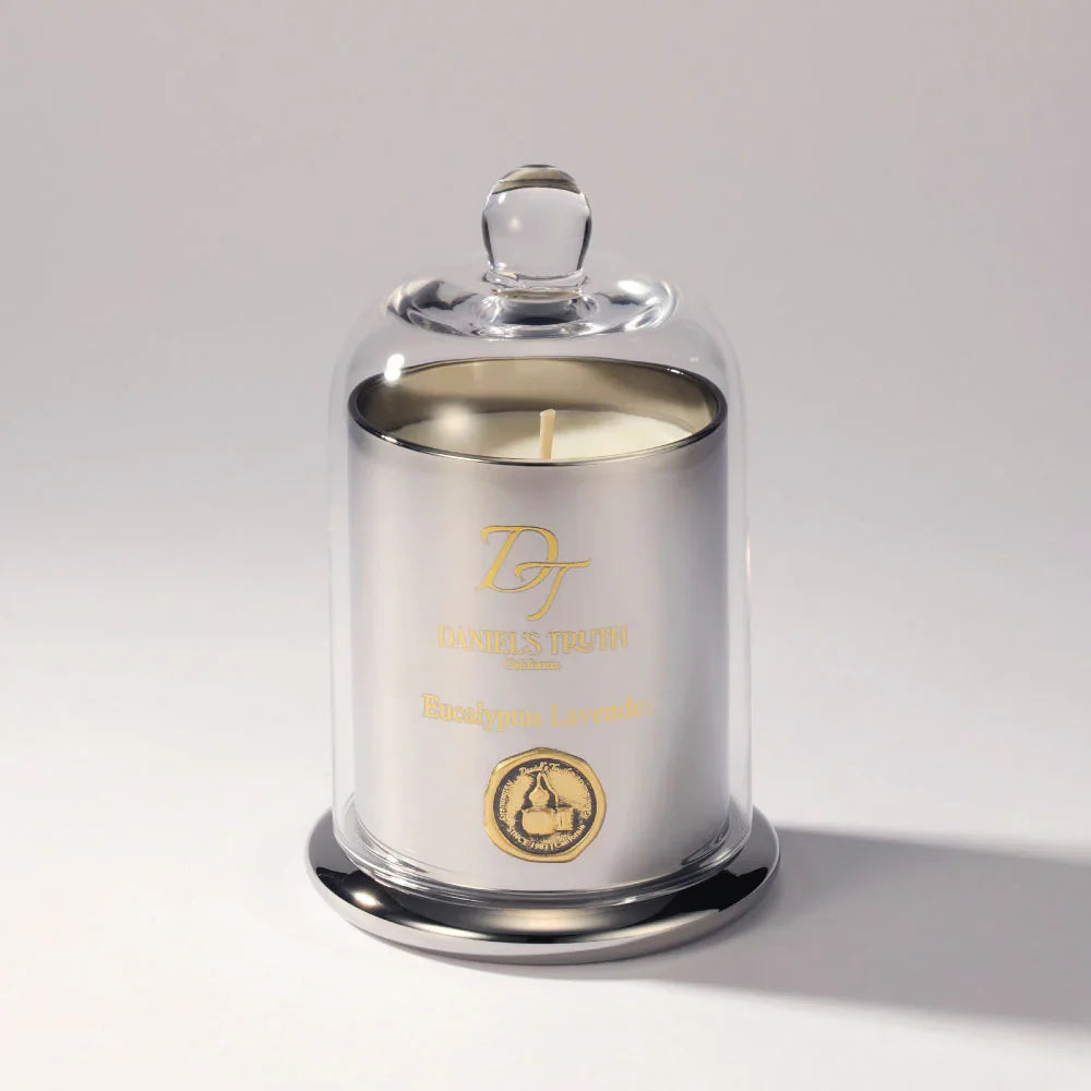 Silver eucalyptus lavender candle in glass cloche on white background