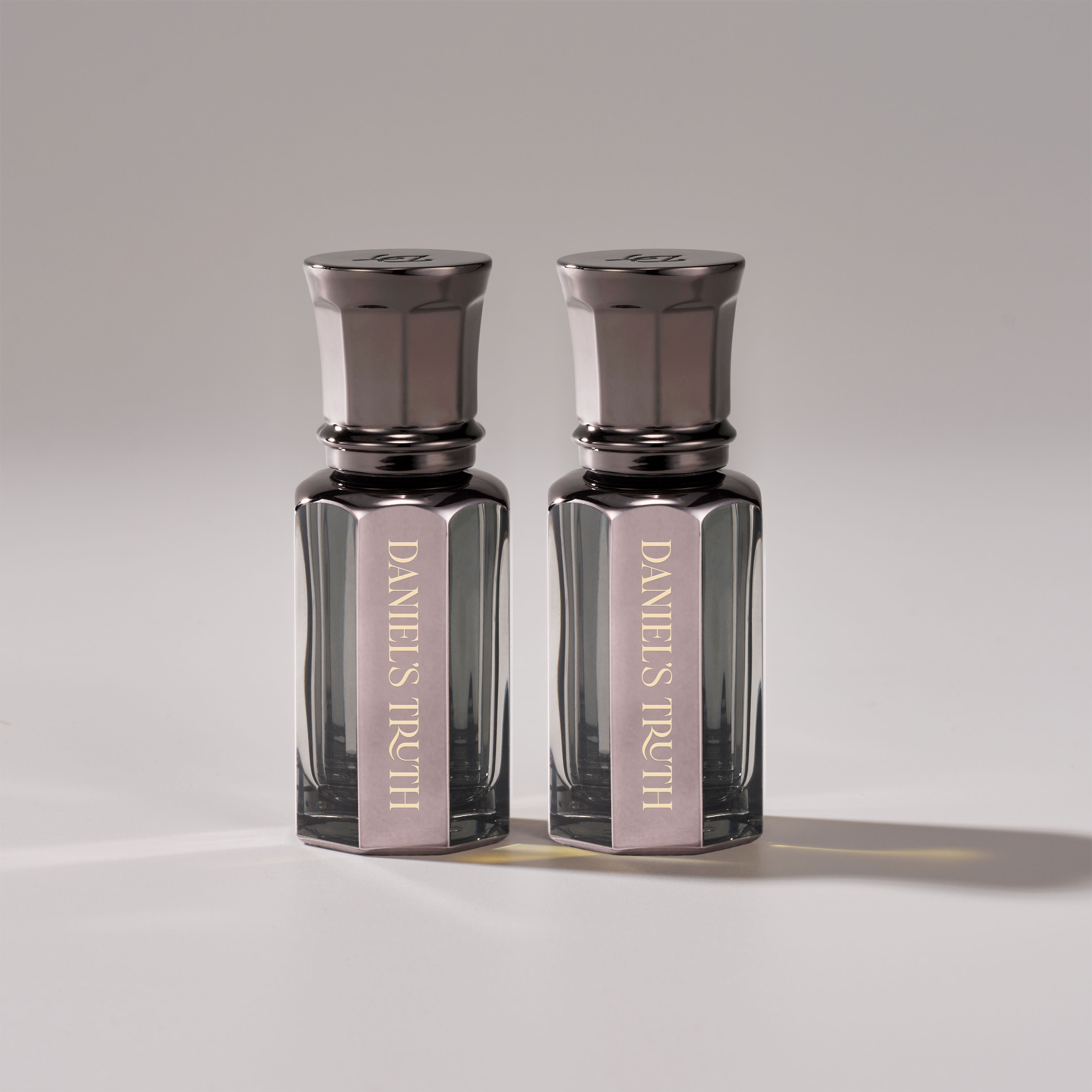 Daniel's Truth Signature Oil Perfume Set with multiple small glass bottles and elegant packaging, showcasing luxurious fragrance options.