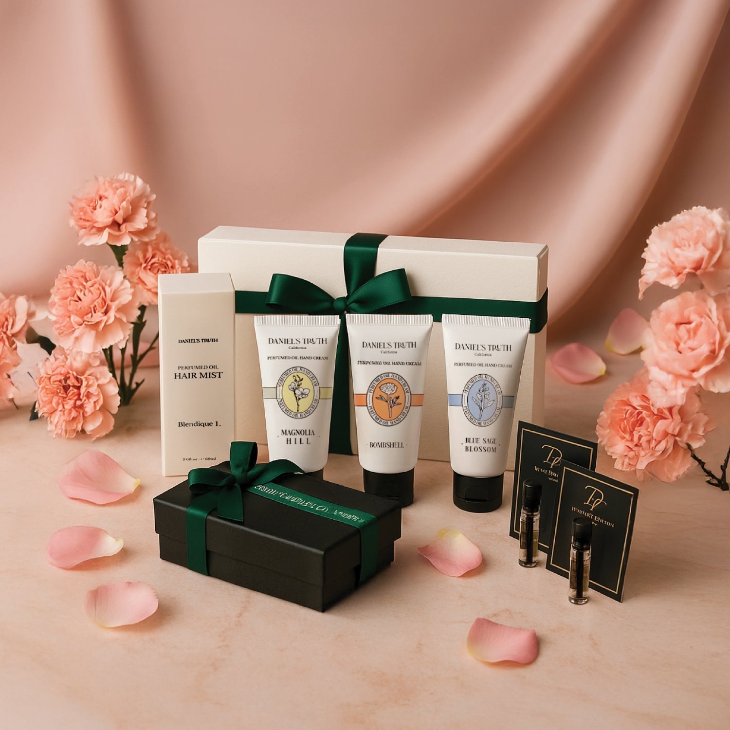 Perfume and hand cream gift set with pink flowers, green ribbon, and rose petals