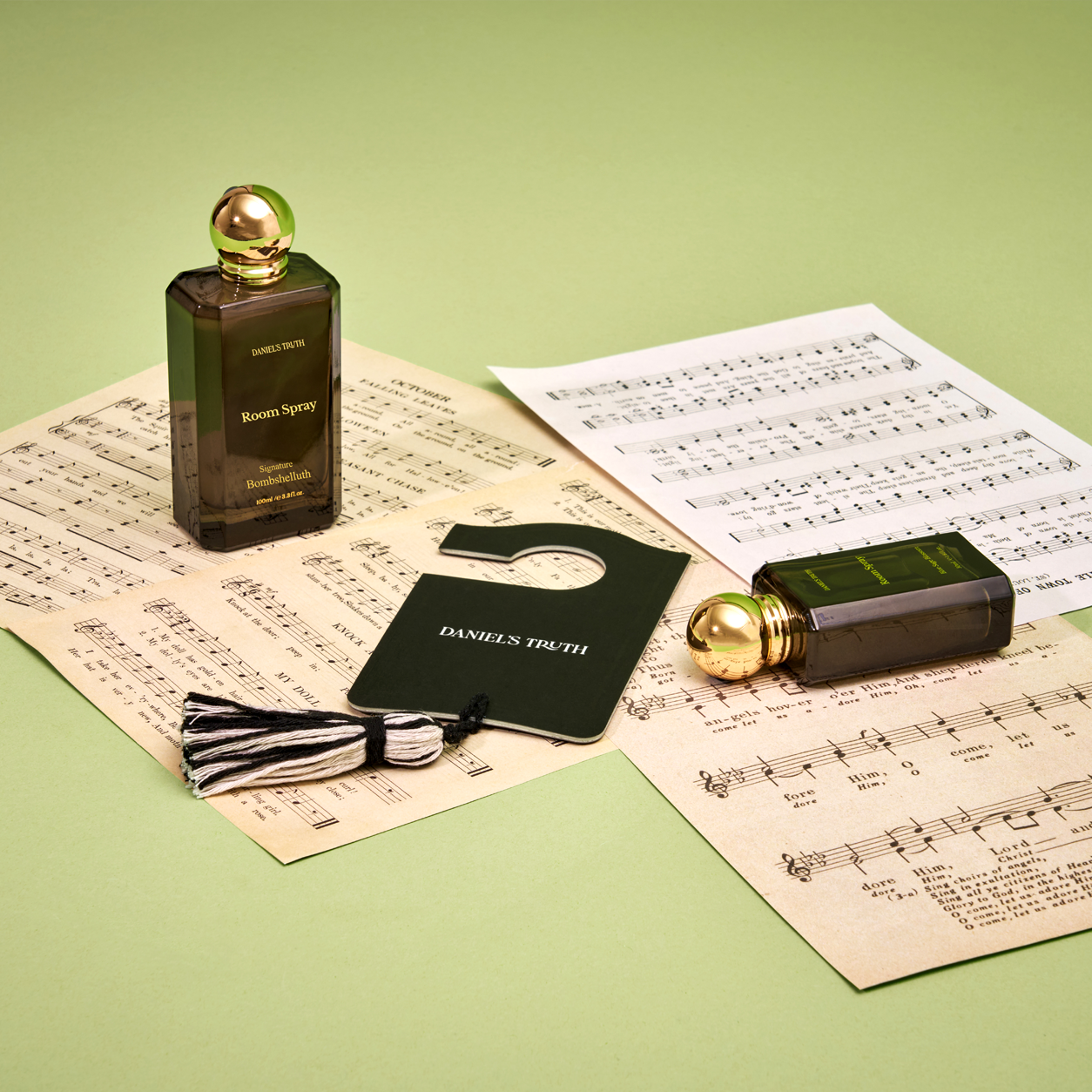 Set of Daniel's Truth room sprays featuring three bottles with floral and citrus scents in elegant packaging.
